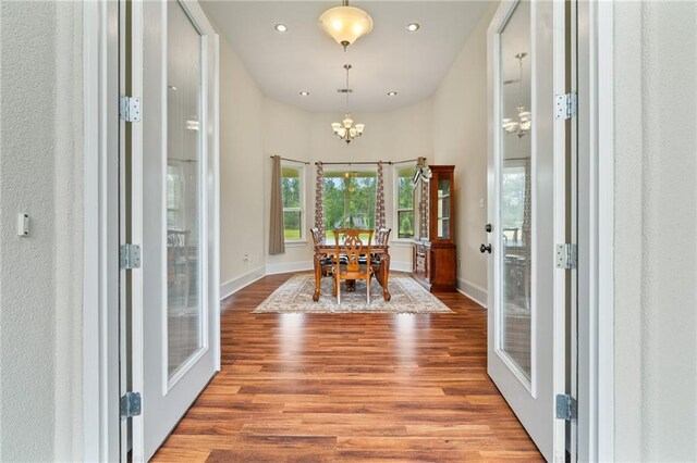 22484 Treadaway St, Mandeville, LA 70471 - entrance foyer with wood finished floors, a chandelier, and recessed lighting