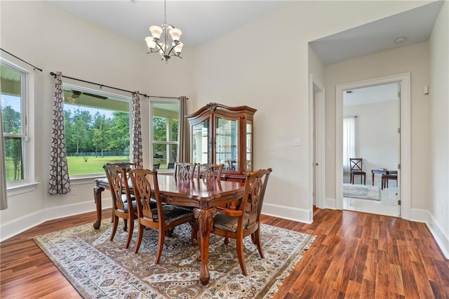 22484 Treadaway St, Mandeville, LA 70471 - dining space featuring a chandelier and wood finished floors