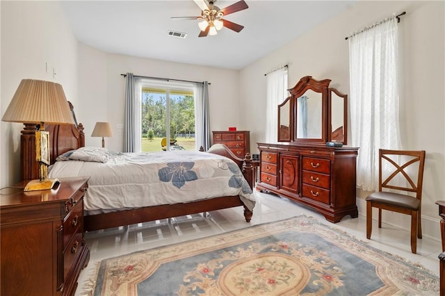 22484 Treadaway St, Mandeville, LA 70471 - bedroom with access to exterior, light tile patterned flooring, and a ceiling fan