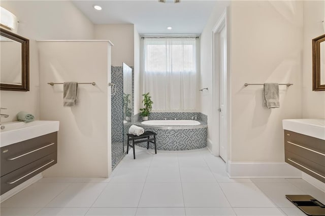 22484 Treadaway St, Mandeville, LA 70471 - full bath featuring vanity, a bath, a walk in shower, and tile patterned flooring