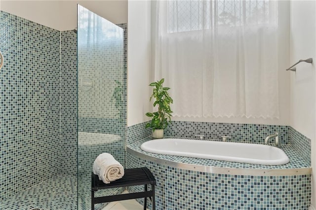 22484 Treadaway St, Mandeville, LA 70471 - bathroom featuring a stall shower, a bath, and tile patterned floors