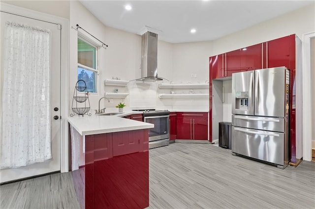 22484 Treadaway St, Mandeville, LA 70471 - kitchen featuring stainless steel appliances, wall chimney range hood, light wood-type flooring, red cabinets, and recessed lighting