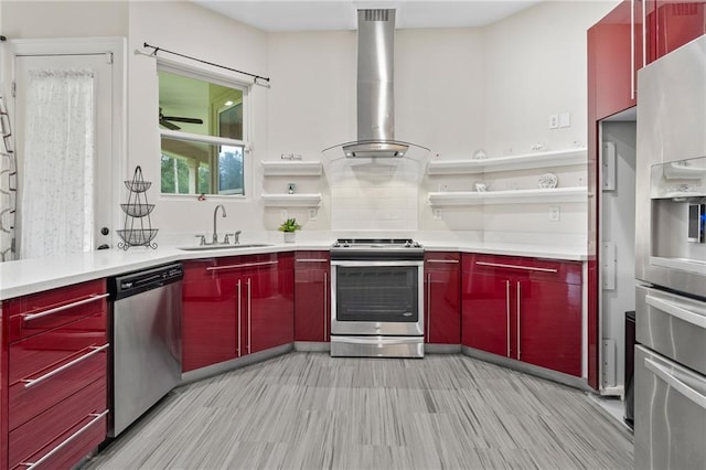 22484 Treadaway St, Mandeville, LA 70471 - kitchen featuring stainless steel appliances, red cabinets, wall chimney exhaust hood, and open shelves