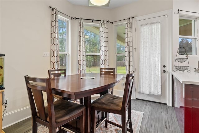22484 Treadaway St, Mandeville, LA 70471 - dining room featuring wood finished floors