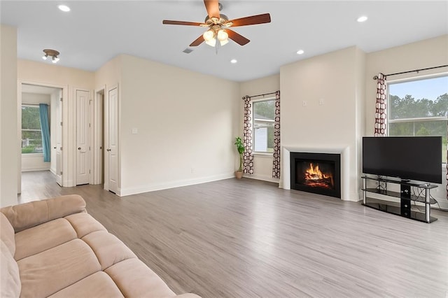 22484 Treadaway St, Mandeville, LA 70471 - living room featuring wood finished floors, healthy amount of natural light, ceiling fan, and recessed lighting