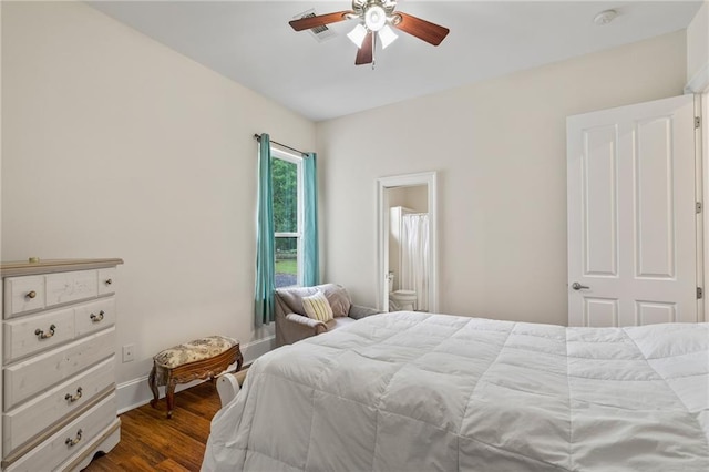 22484 Treadaway St, Mandeville, LA 70471 - bedroom featuring dark wood-style floors, ceiling fan, and ensuite bath
