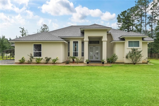 22484 Treadaway St, Mandeville, LA 70471 - view of front of property featuring french doors, a front lawn, roof with shingles, and stucco siding