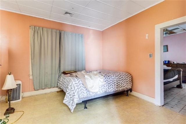 719 W Vine St, Opelousas, LA 70570 - bedroom with tile patterned floors and a drop ceiling