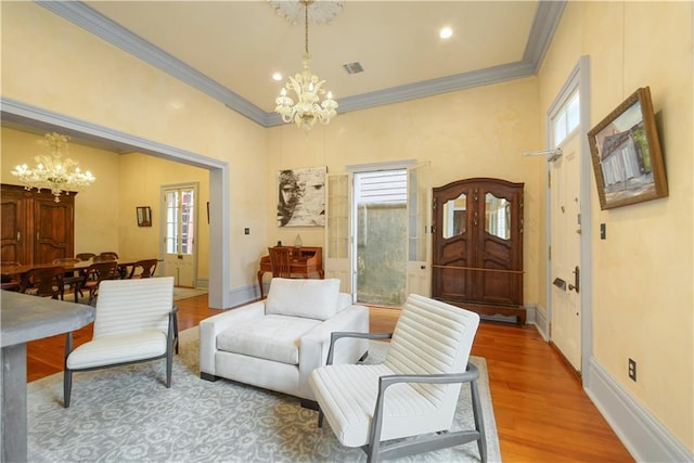 101921 Saint Peter St, New Orleans, LA 70116 - living room featuring a chandelier, crown molding, wood finished floors, and recessed lighting