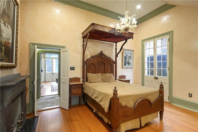 101921 Saint Peter St, New Orleans, LA 70116 - bedroom featuring wood finished floors, a chandelier, and ornamental molding