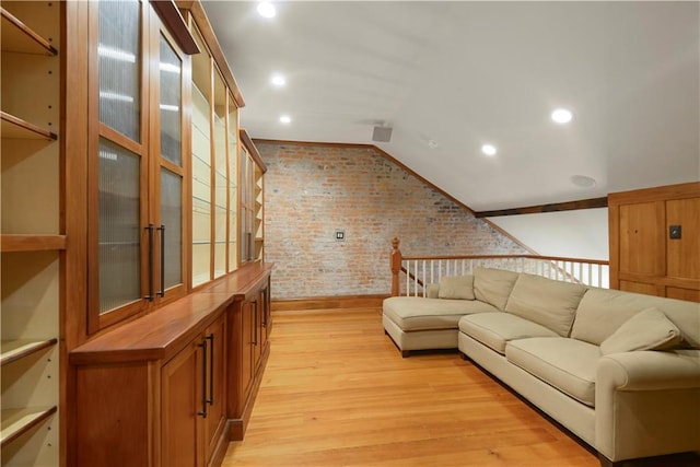 101921 Saint Peter St, New Orleans, LA 70116 - living area featuring brick wall, light wood-style flooring, vaulted ceiling, and recessed lighting