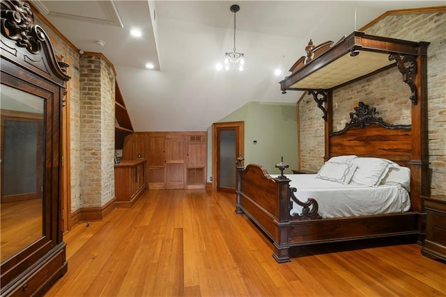 101921 Saint Peter St, New Orleans, LA 70116 - bedroom featuring vaulted ceiling, light wood-style flooring, brick wall, and recessed lighting