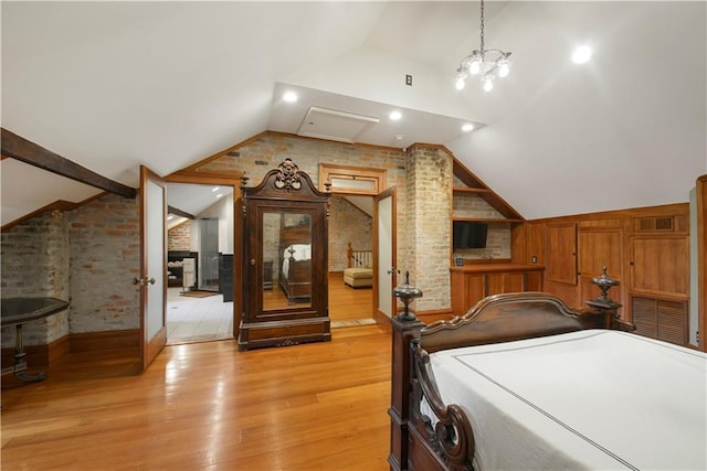 101921 Saint Peter St, New Orleans, LA 70116 - bedroom with vaulted ceiling, brick wall, and light wood finished floors