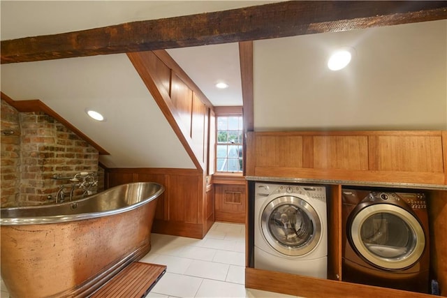 101921 Saint Peter St, New Orleans, LA 70116 - laundry area featuring separate washer and dryer, wainscoting, light tile patterned floors, recessed lighting, and wooden walls