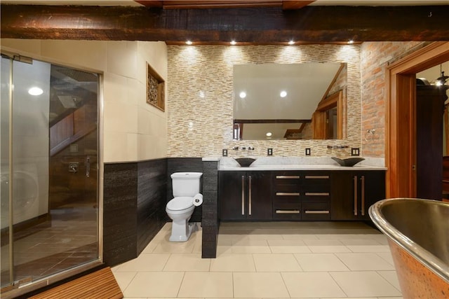 101921 Saint Peter St, New Orleans, LA 70116 - bathroom featuring double vanity, a shower stall, beam ceiling, a soaking tub, and tile patterned flooring