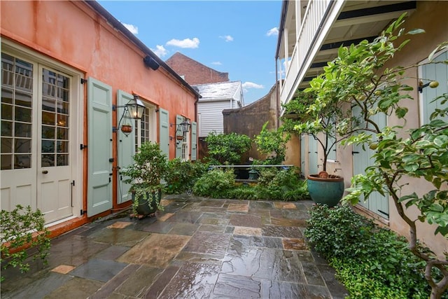 101921 Saint Peter St, New Orleans, LA 70116 - view of patio featuring french doors