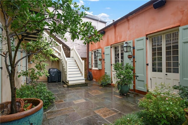 101921 Saint Peter St, New Orleans, LA 70116 - view of patio featuring stairs and a grill