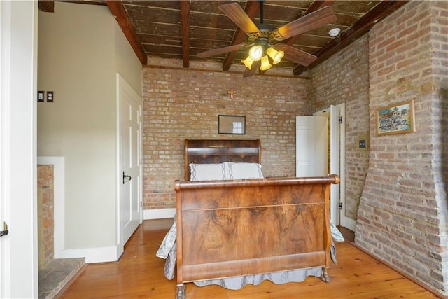 101921 Saint Peter St, New Orleans, LA 70116 - bedroom with brick wall, wood finished floors, and a wood ceiling with exposed beams