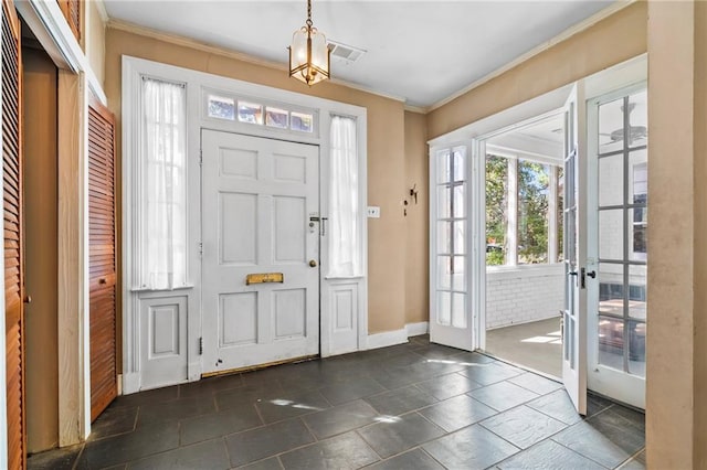 1316 Lowerline St, New Orleans, LA 70118 - foyer entrance with french doors, ornamental molding, and a chandelier