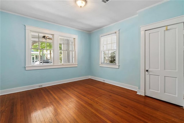 1316 Lowerline St, New Orleans, LA 70118 - empty room featuring dark wood-type flooring and ornamental molding