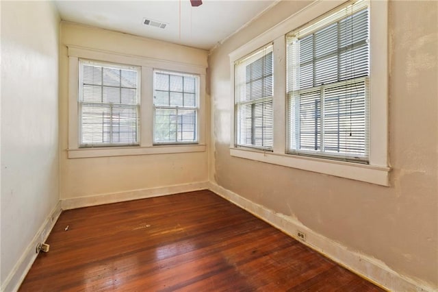 1316 Lowerline St, New Orleans, LA 70118 - spare room with dark wood finished floors and a ceiling fan