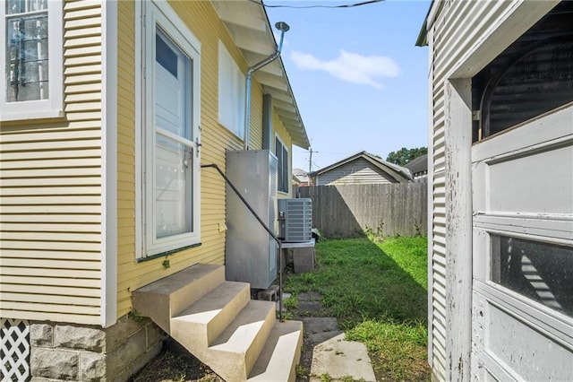 1316 Lowerline St, New Orleans, LA 70118 - view of property exterior with entry steps and a central AC unit
