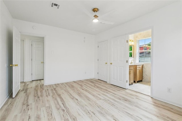 1621 Congress St, New Orleans, LA 70117 - unfurnished bedroom with light wood-type flooring, connected bathroom, a closet, and ceiling fan