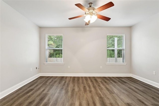 41151 Snowball Cir, Ponchatoula, LA 70454 - unfurnished room with healthy amount of natural light, dark wood-type flooring, and ceiling fan