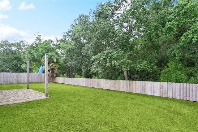 41151 Snowball Cir, Ponchatoula, LA 70454 - fenced backyard with a patio area
