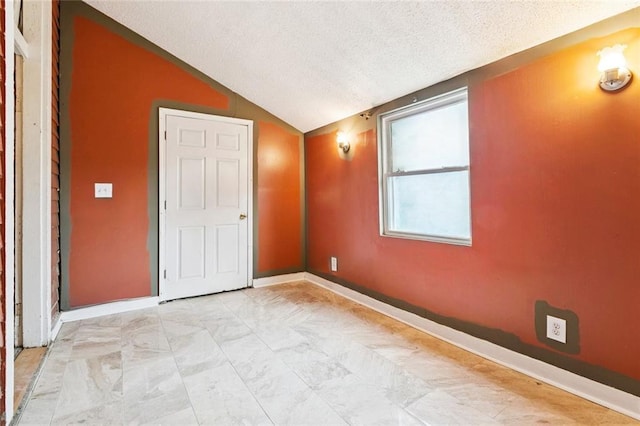 264951 Bruxelles St, New Orleans, LA 70119 - unfurnished bedroom featuring a textured ceiling and lofted ceiling