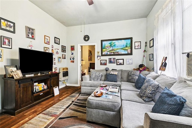 264951 Bruxelles St, New Orleans, LA 70119 - living area featuring heating unit, wood finished floors, and a ceiling fan