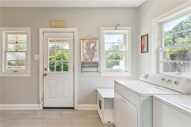 4472 Demontluzin St, New Orleans, LA 70122 - washroom featuring washing machine and clothes dryer and plenty of natural light