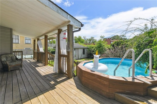 4472 Demontluzin St, New Orleans, LA 70122 - view of swimming pool featuring a deck
