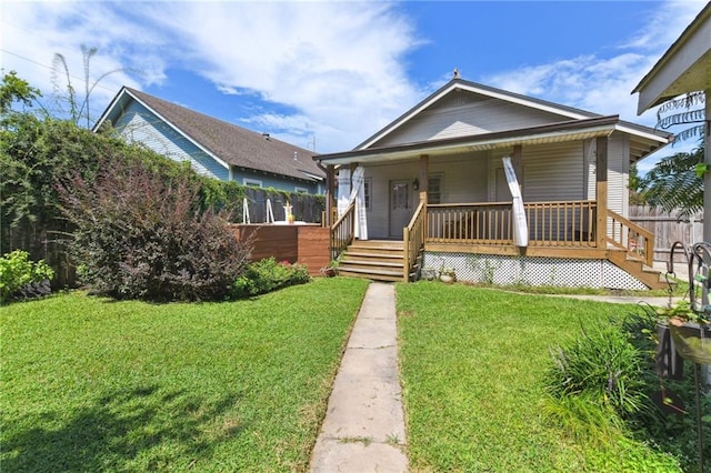 4472 Demontluzin St, New Orleans, LA 70122 - bungalow-style home with a porch
