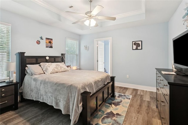 1383 Cherry St, Slidell, LA 70460 - bedroom with a tray ceiling, wood finished floors, crown molding, and ceiling fan