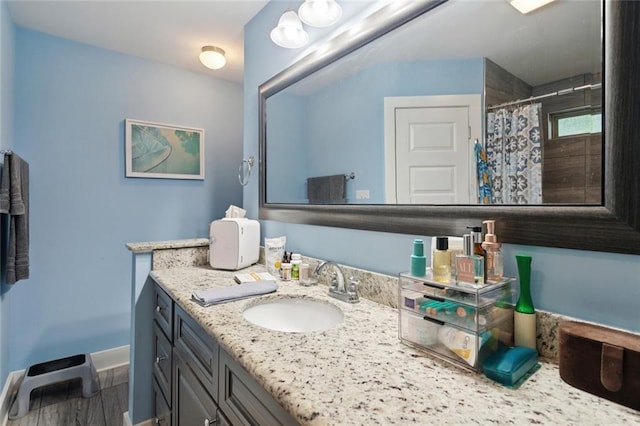 1383 Cherry St, Slidell, LA 70460 - full bathroom with vanity, curtained shower, and wood finished floors