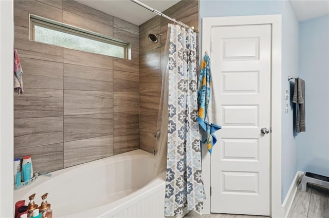1383 Cherry St, Slidell, LA 70460 - bathroom featuring shower / bath combo with shower curtain and baseboards