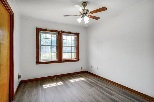 15 Tulip Dr, Gretna, LA 70053 - spare room with wood finished floors, ornamental molding, and a ceiling fan