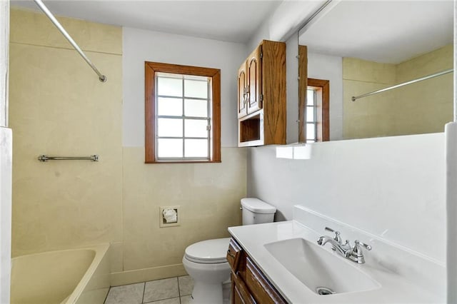 15 Tulip Dr, Gretna, LA 70053 - full bathroom featuring healthy amount of natural light, vanity, tile patterned flooring, and bathtub / shower combination