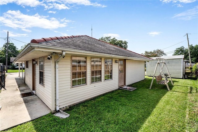 15 Tulip Dr, Gretna, LA 70053 - rear view of property with a lawn