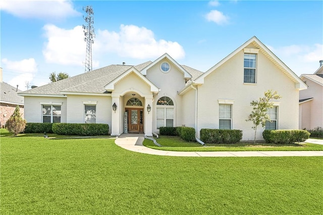 24 Minter Dr, Mandeville, LA 70471 - traditional-style house featuring a front lawn, roof with shingles, and brick siding
