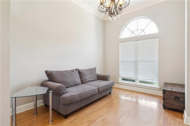 24 Minter Dr, Mandeville, LA 70471 - sitting room featuring a chandelier, crown molding, and light wood-style floors