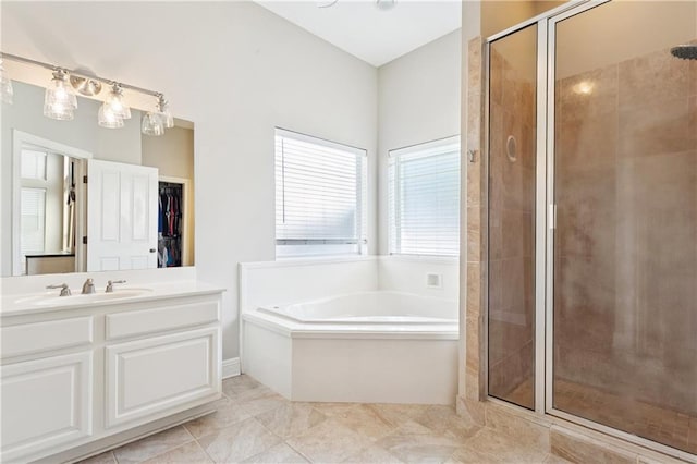 24 Minter Dr, Mandeville, LA 70471 - full bath featuring a garden tub, a shower stall, vanity, and a walk in closet