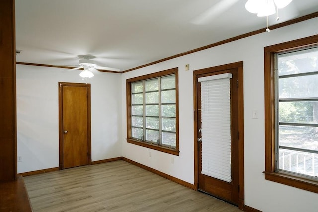 6 Gelbke Dr, Gretna, LA 70053 - empty room featuring a ceiling fan, plenty of natural light, light wood-style floors, and crown molding
