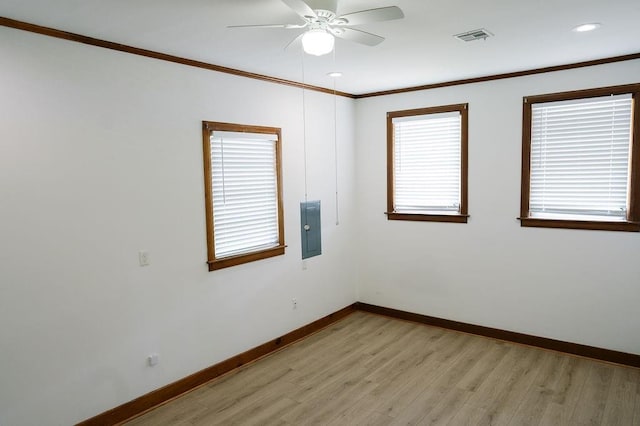 6 Gelbke Dr, Gretna, LA 70053 - unfurnished room featuring electric panel, a ceiling fan, light wood-style floors, ornamental molding, and recessed lighting
