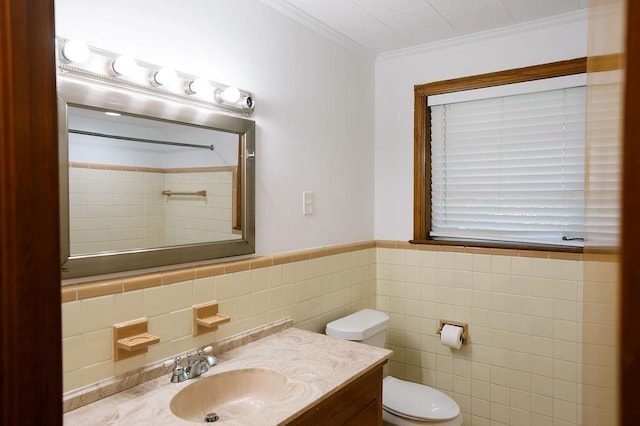 6 Gelbke Dr, Gretna, LA 70053 - bathroom with tile walls, a shower, vanity, crown molding, and wainscoting