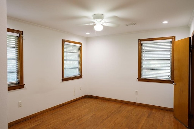 6 Gelbke Dr, Gretna, LA 70053 - empty room with ceiling fan, wood finished floors, plenty of natural light, crown molding, and recessed lighting