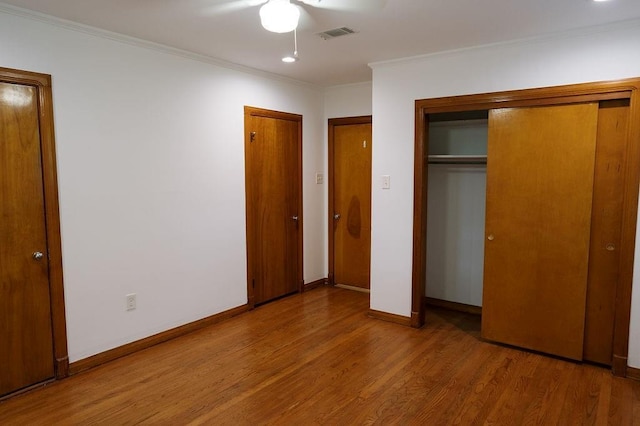 6 Gelbke Dr, Gretna, LA 70053 - unfurnished bedroom featuring wood finished floors, ornamental molding, and a closet