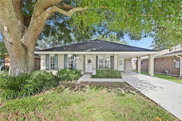 4412 Clearlake Dr, Metairie, LA 70006 - single story home featuring an attached carport, brick siding, driveway, and a front yard