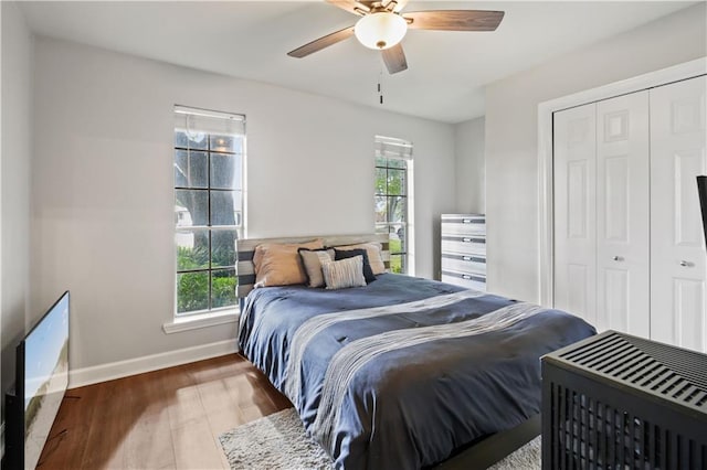 4412 Clearlake Dr, Metairie, LA 70006 - bedroom featuring multiple windows, wood finished floors, a closet, and ceiling fan